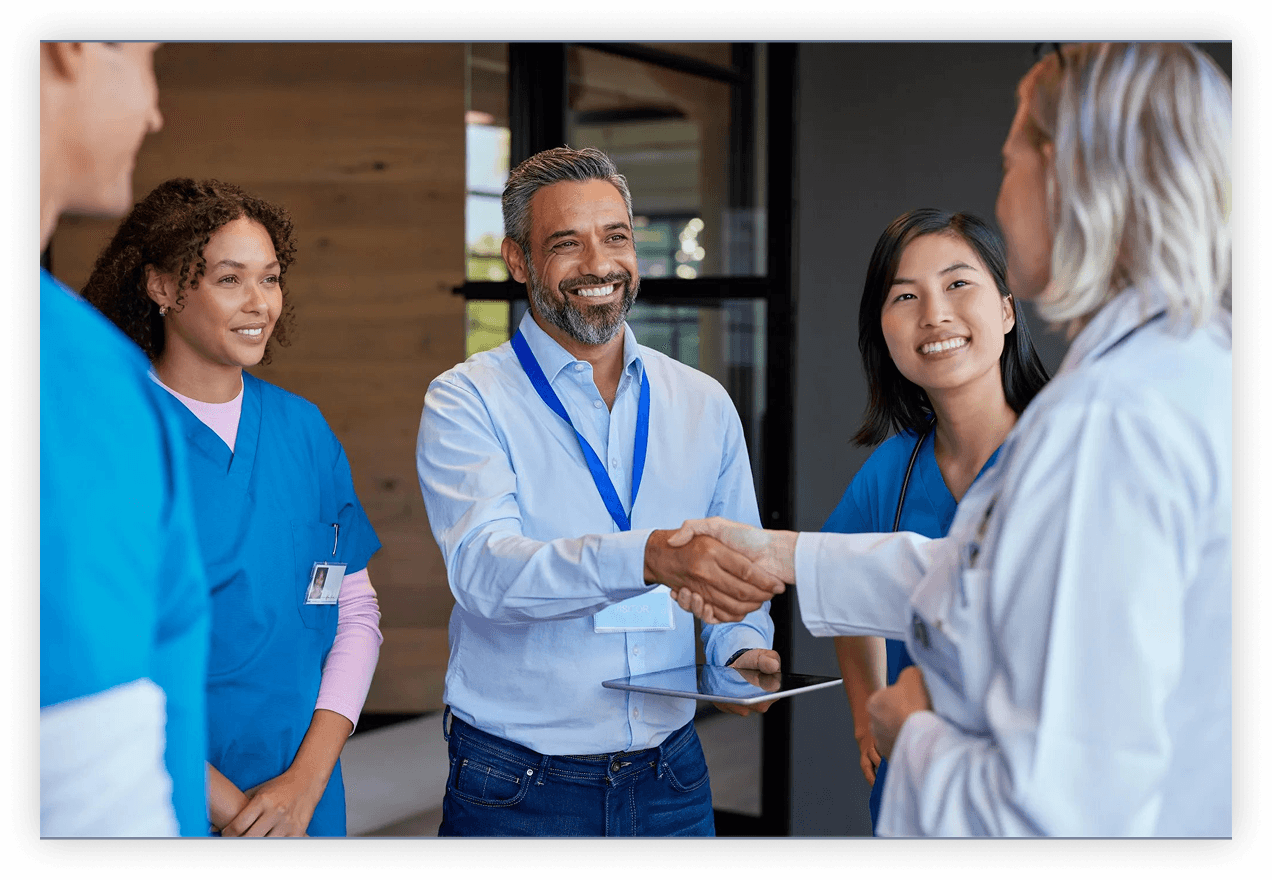 Two professionals shaking hands in a business meeting