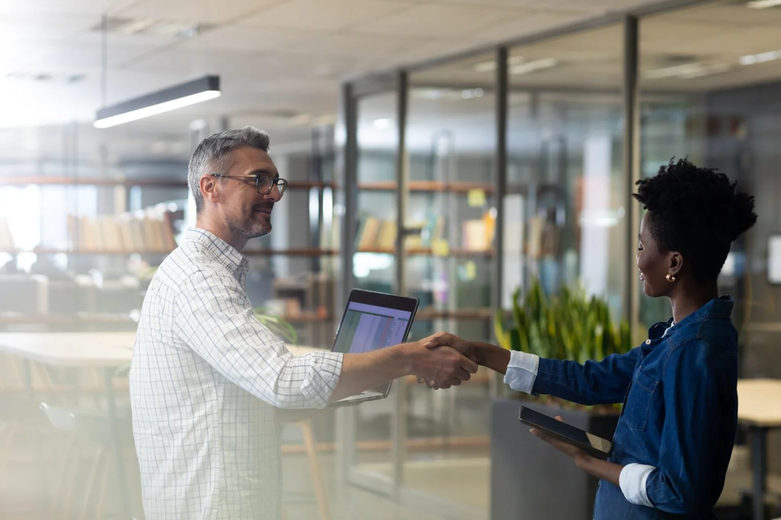 Business professionals shaking hands in a professional setting